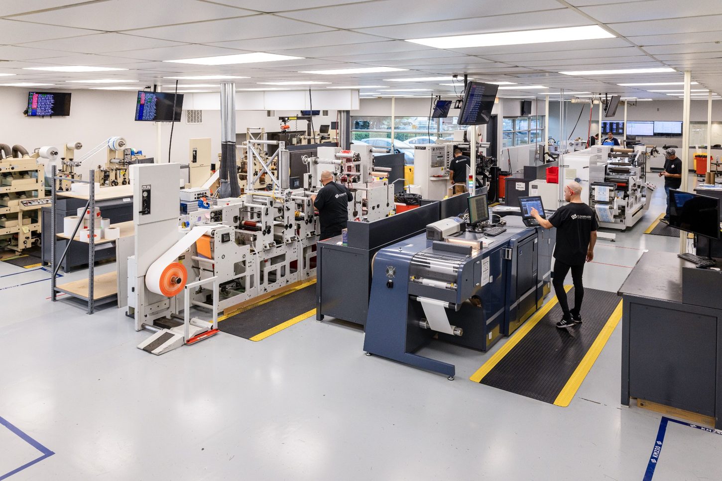 CleanMark manufacturing floor with label converting and printing equipment in operation